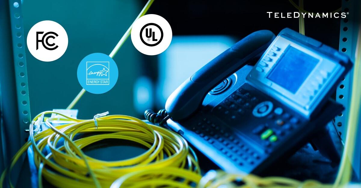 Desktop phone with logos of telecom and networking equipment certifications - TeleDynamics blog