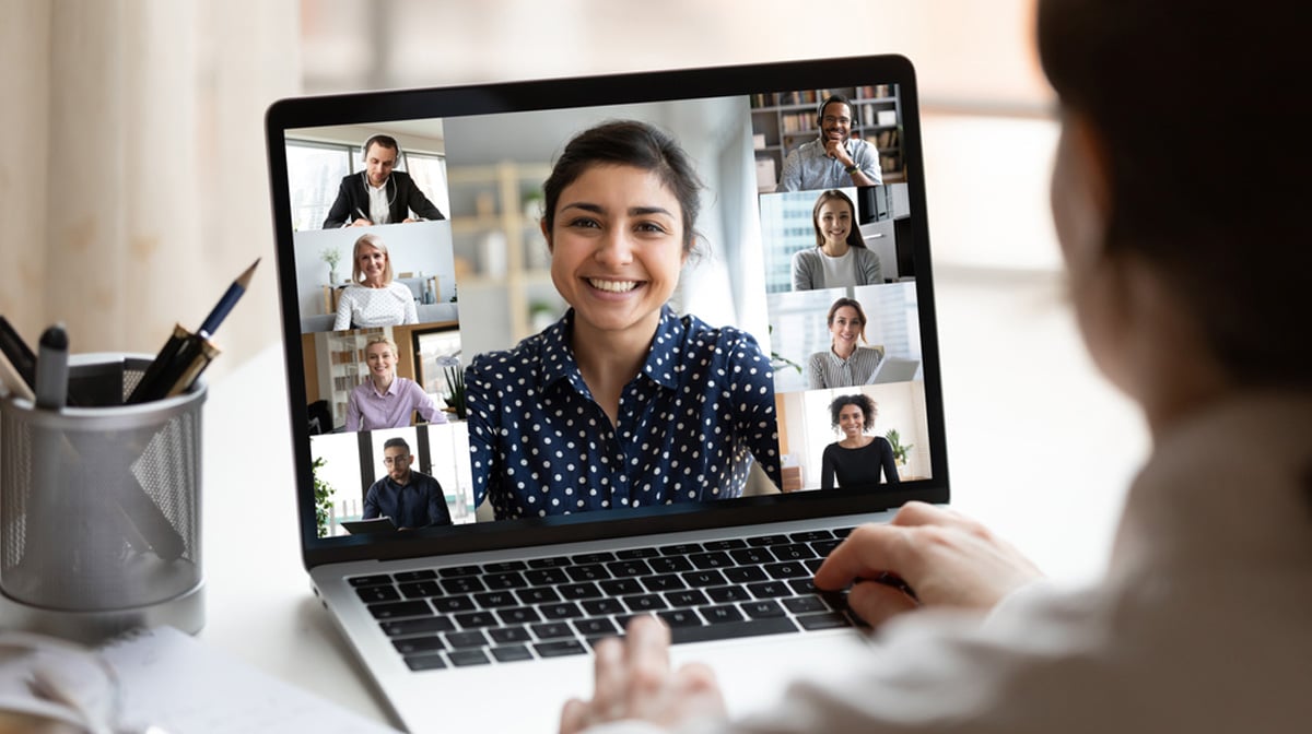 woman participating in a videoconference on her laptop