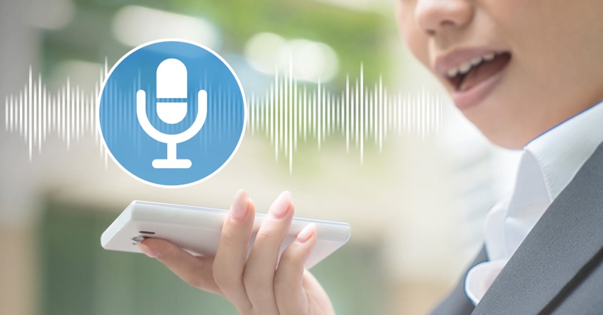 woman speaking into a phone with speech recognition