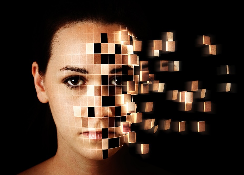 transitioning from analog to digital - image of face disintegrating into squares