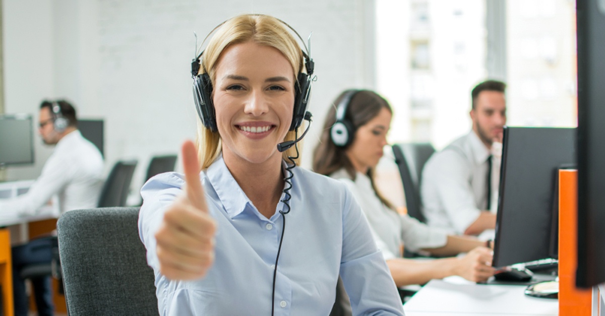 worker on the phone giving thumbs-up sign