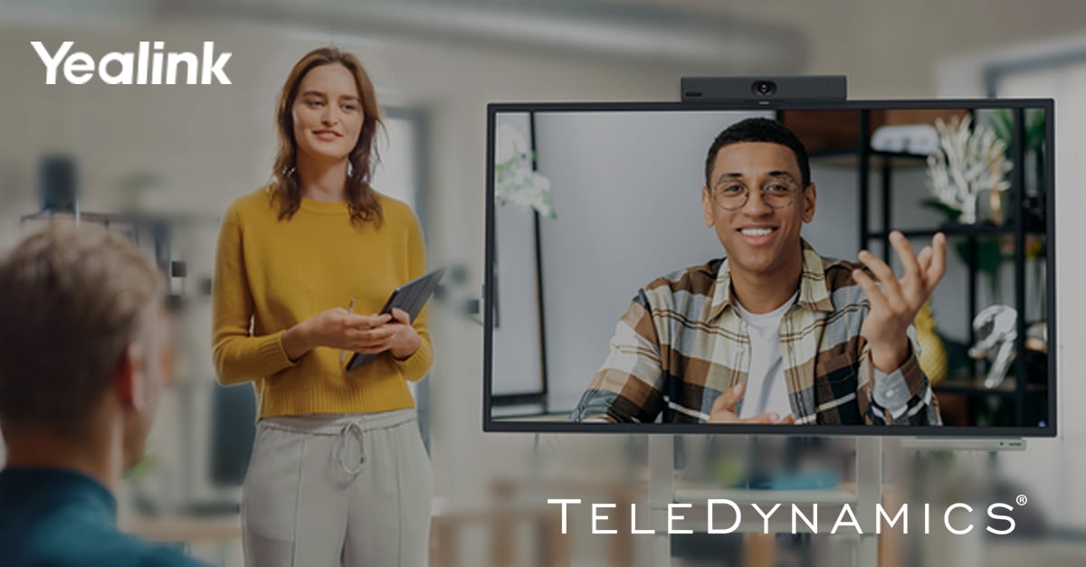 Workers using Yealink videoconferencing equipment - TeleDynamics blog